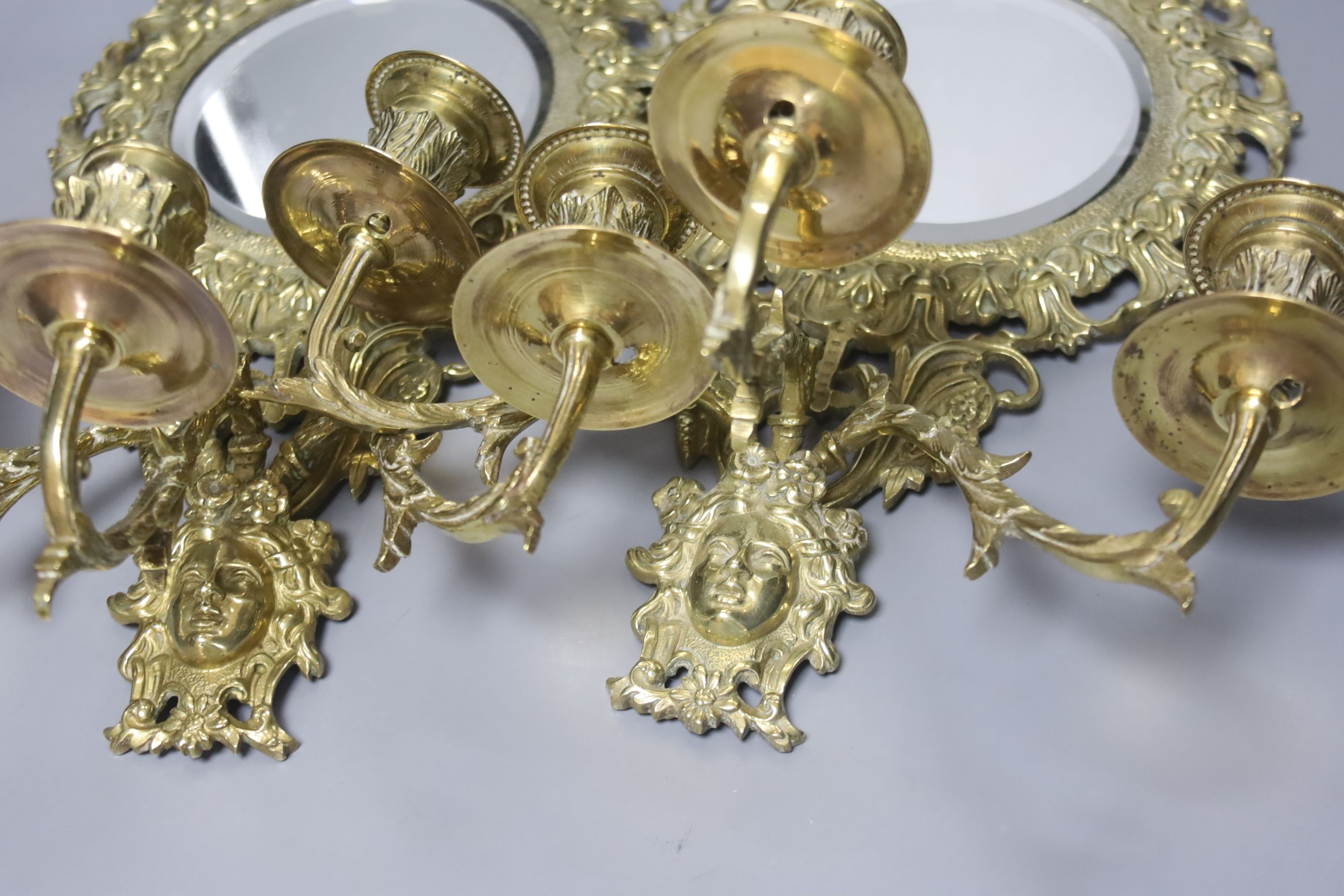 A pair of late 19th century French cast brass three sconce girandoles, height 42cm